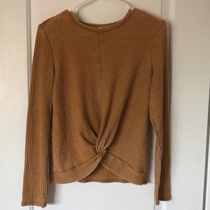 Textures long sleeve shirt with twist in front.